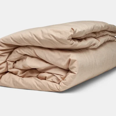 folded natural duvet cover shown with comforter insert