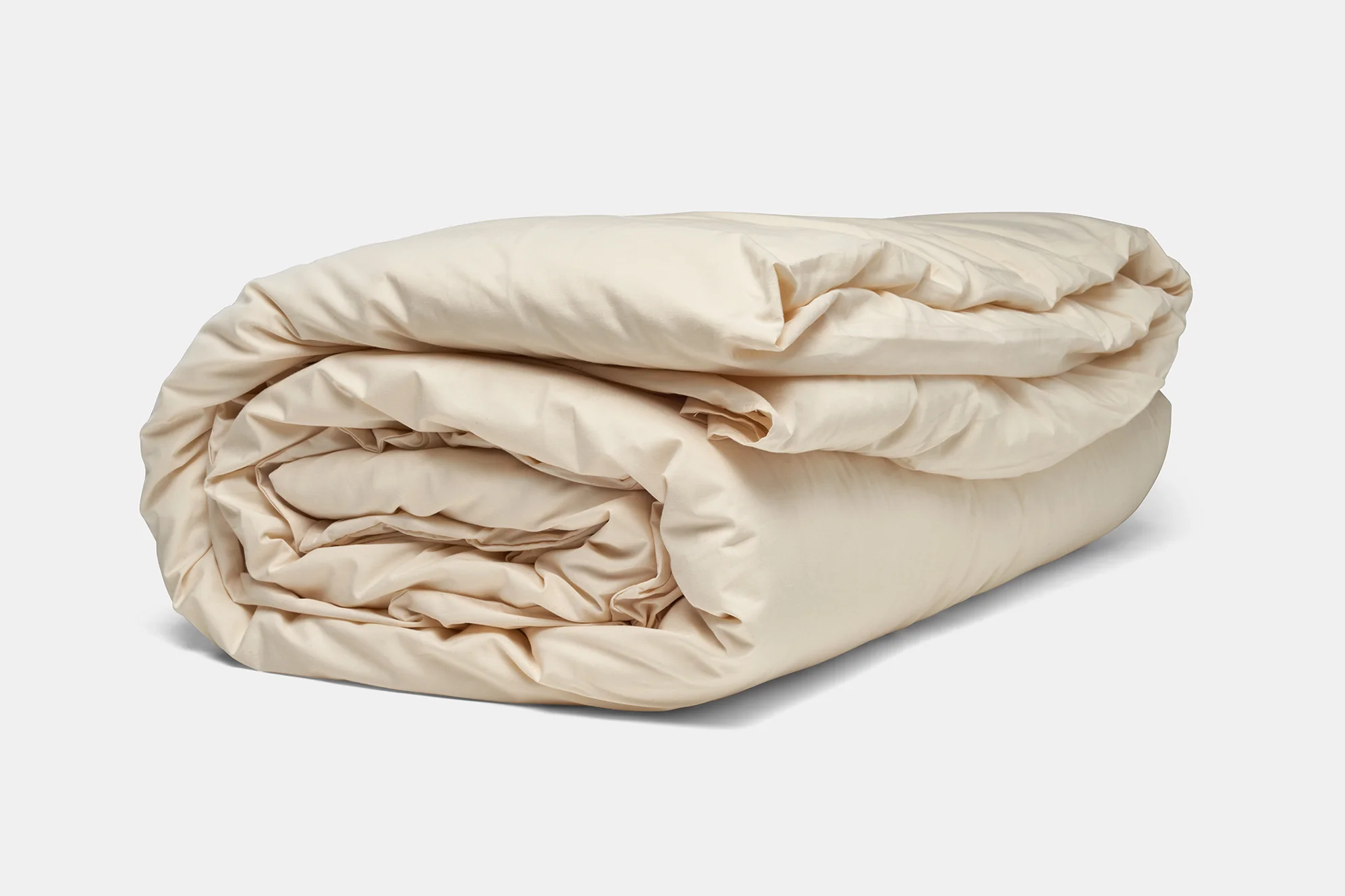 folded natural duvet cover shown with comforter insert