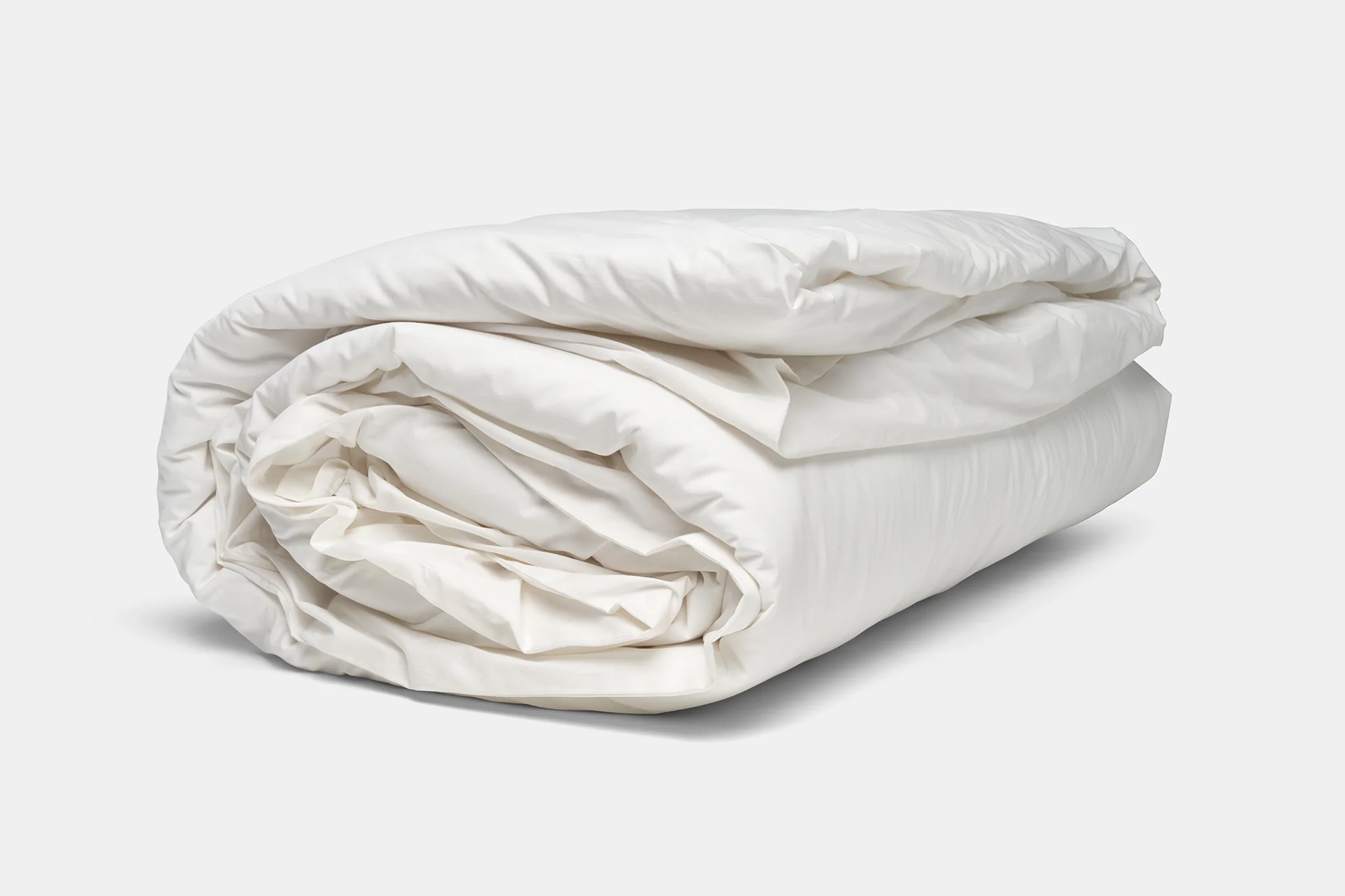 folded white duvet cover shown with comforter insert