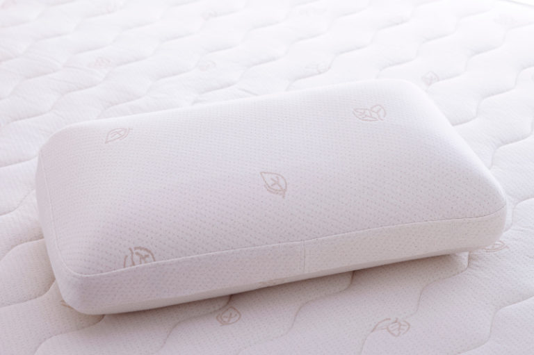 Latex Oxygen Pillow on a mattress. Full shot.