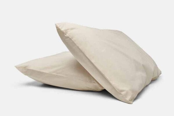 Two natural cotton percale pillows stacked